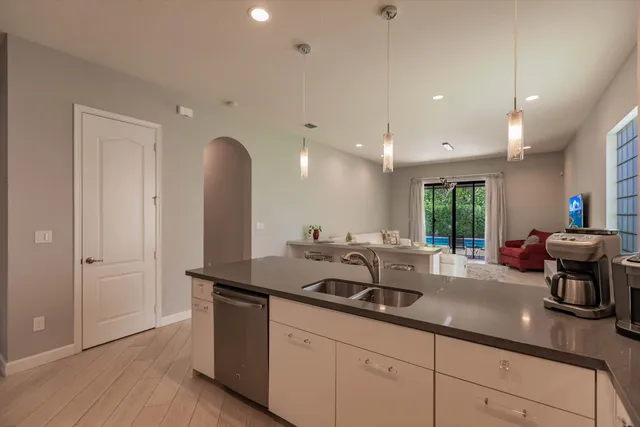 a kitchen with sink and window
