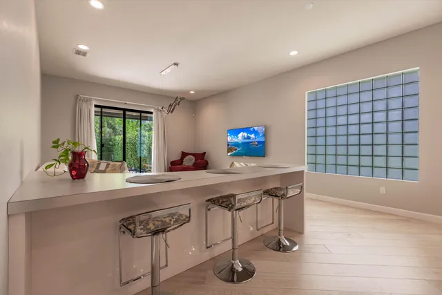a kitchen with a sink a window and a table