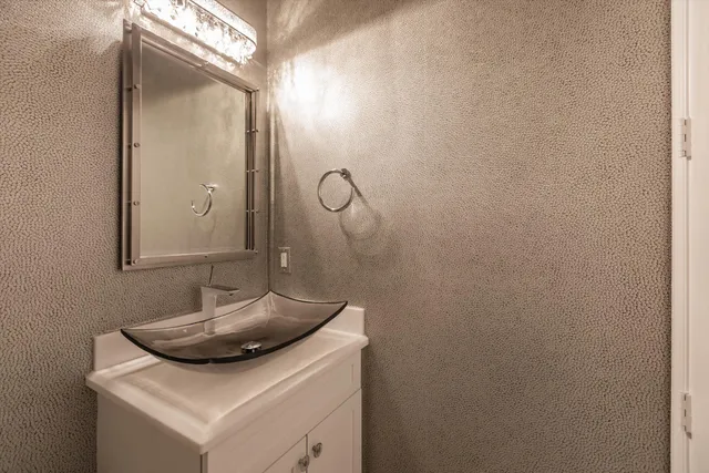 a bathroom with a sink and mirror
