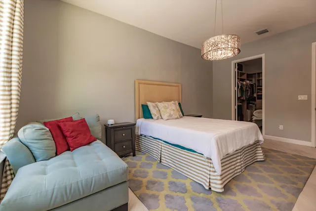 a bedroom with a bed and a couch