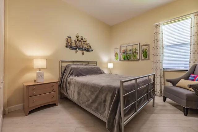 a bedroom with a bed and a couch