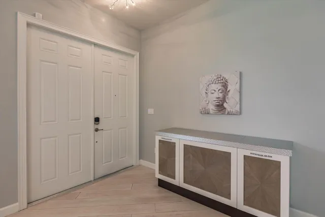 a view of an empty room with closet