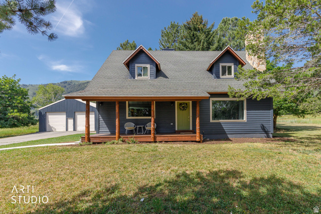 2807 North Ogden Canyon Road Eden, UT 84310 - Photo 5 of 72 Blue siding facade with a covered porch featuring natural wood posts
