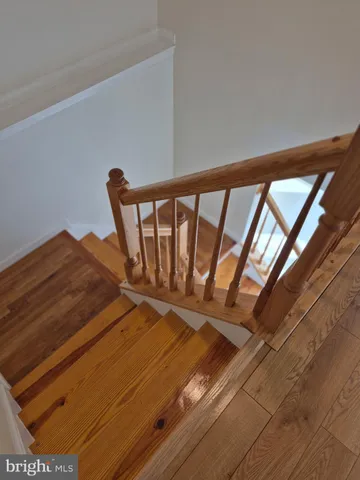 a view of an empty room with a ceiling fan