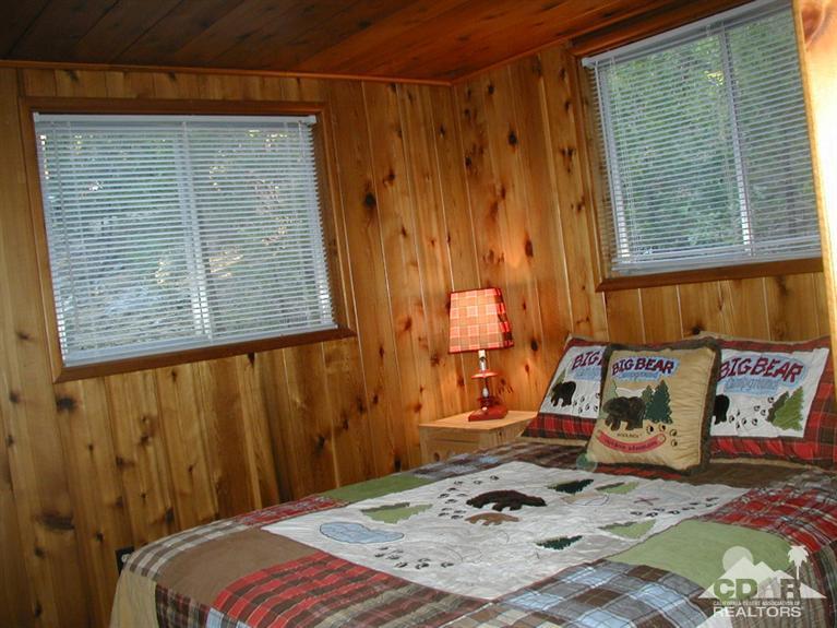 55290 Circle Way Idyllwild, CA 92549 - Photo 8 of 11 a bed sitting in a bedroom next to a window