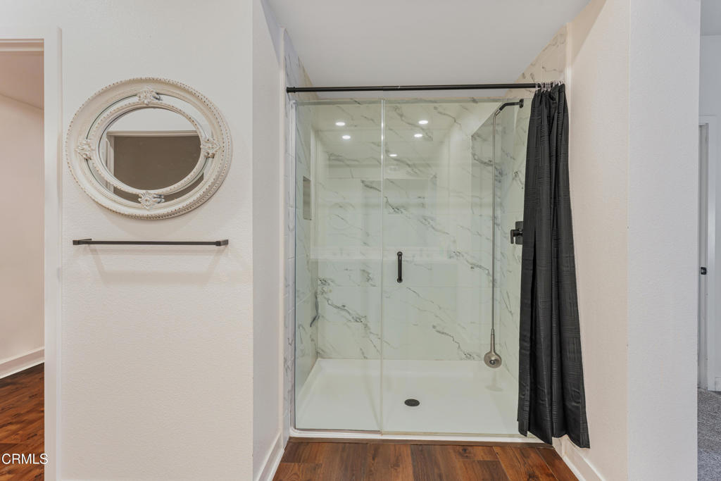 2820 Wagon Wheel Road, Unit 302 Oxnard, CA 93036 - Photo 13 of 26 a bathroom with a bathtub and a shower