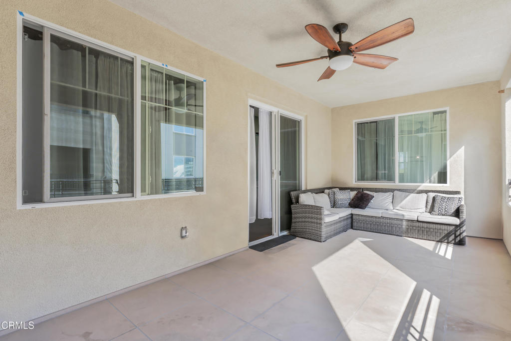 2820 Wagon Wheel Road, Unit 302 Oxnard, CA 93036 - Photo 20 of 26 a living room with furniture and a large window