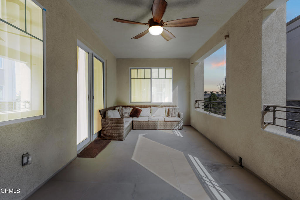 2820 Wagon Wheel Road, Unit 302 Oxnard, CA 93036 - Photo 21 of 26 a bed room with a bed and a chandelier