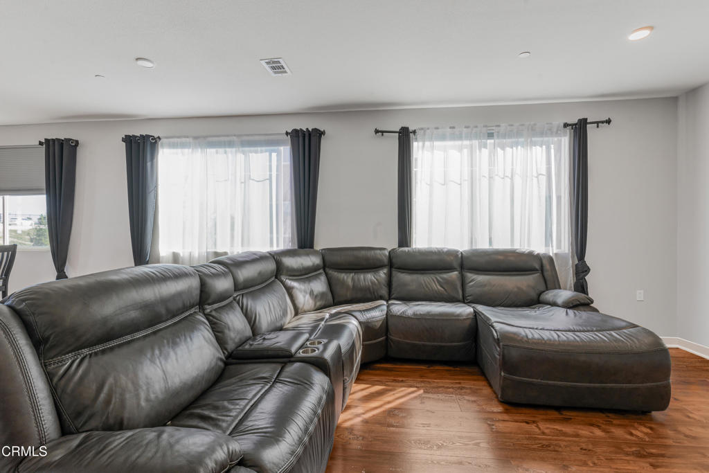 2820 Wagon Wheel Road, Unit 302 Oxnard, CA 93036 - Photo 4 of 26 a living room with furniture and a window