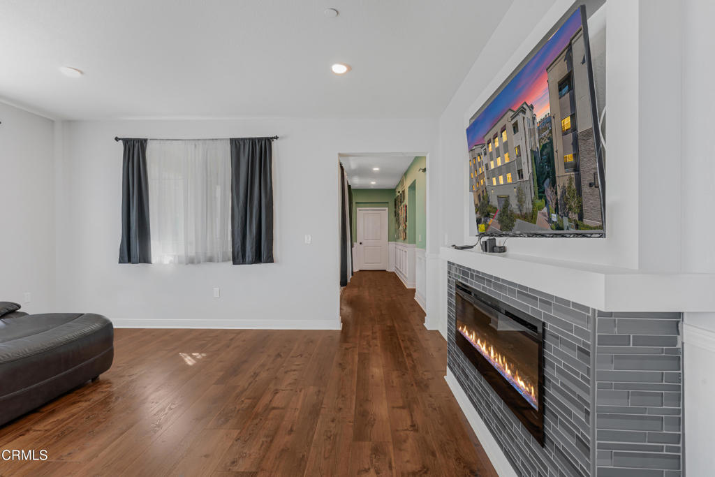 2820 Wagon Wheel Road, Unit 302 Oxnard, CA 93036 - Photo 5 of 26 a living room with furniture and a fireplace