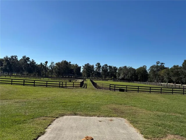 a view of a golf course with a lake