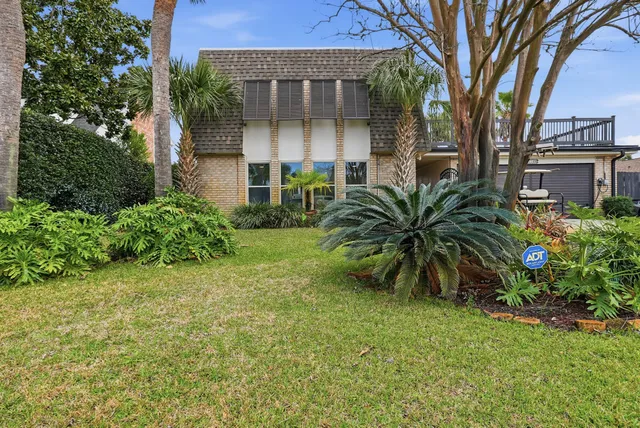 front view of a house with a garden