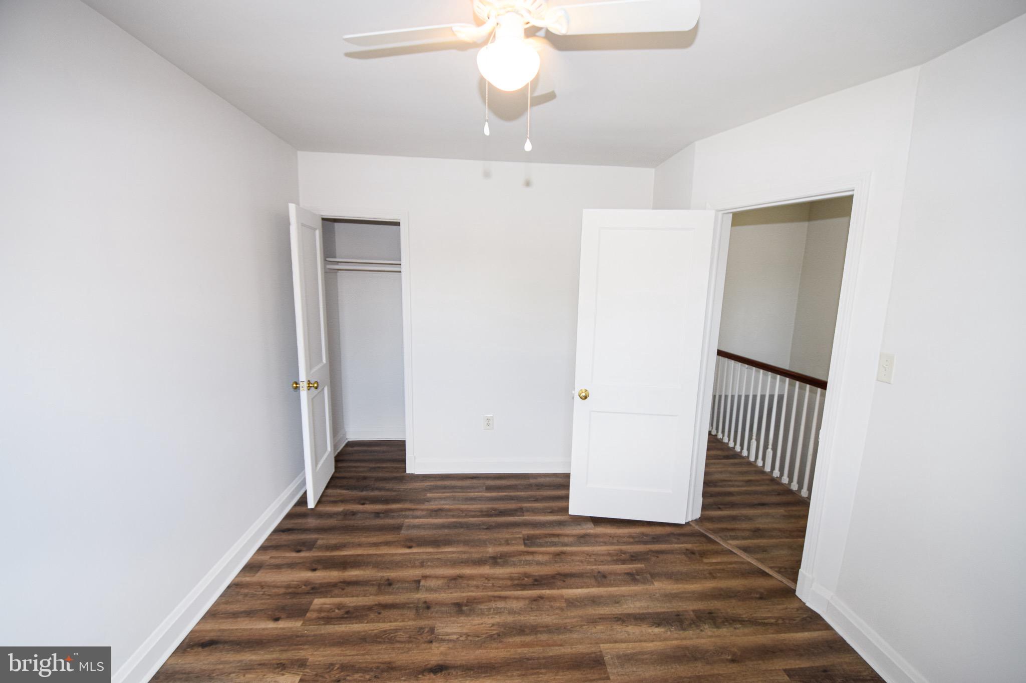 1922 Armco Way Dundalk, MD 21222 - Photo 13 of 26 a view of a hallway with wooden floor and staircase