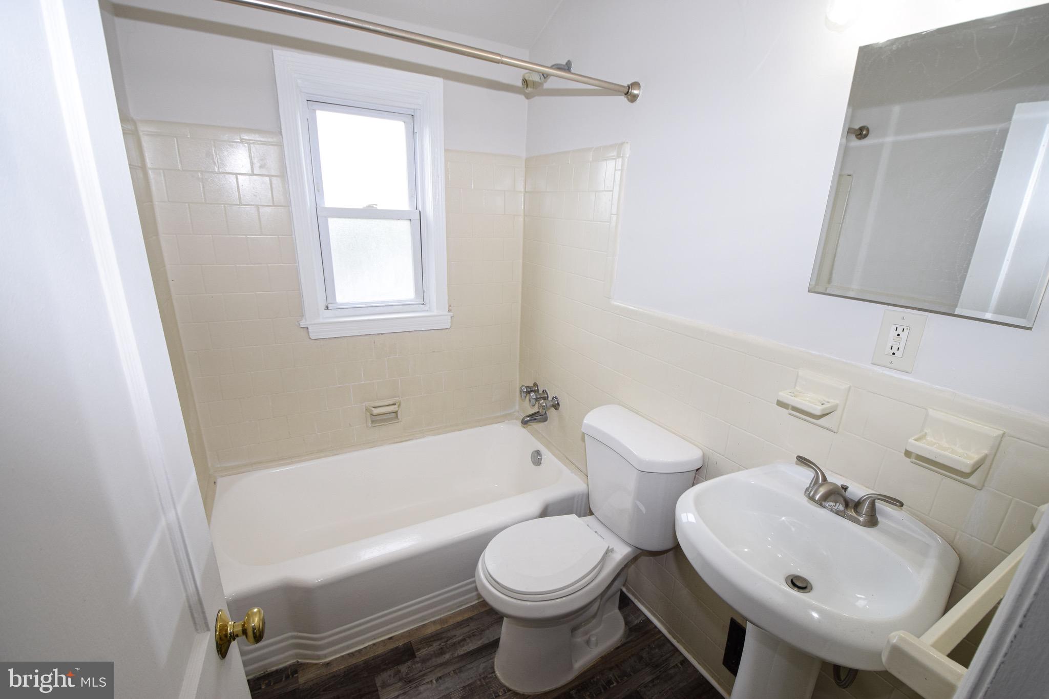 1922 Armco Way Dundalk, MD 21222 - Photo 14 of 26 a bathroom with a sink toilet and shower