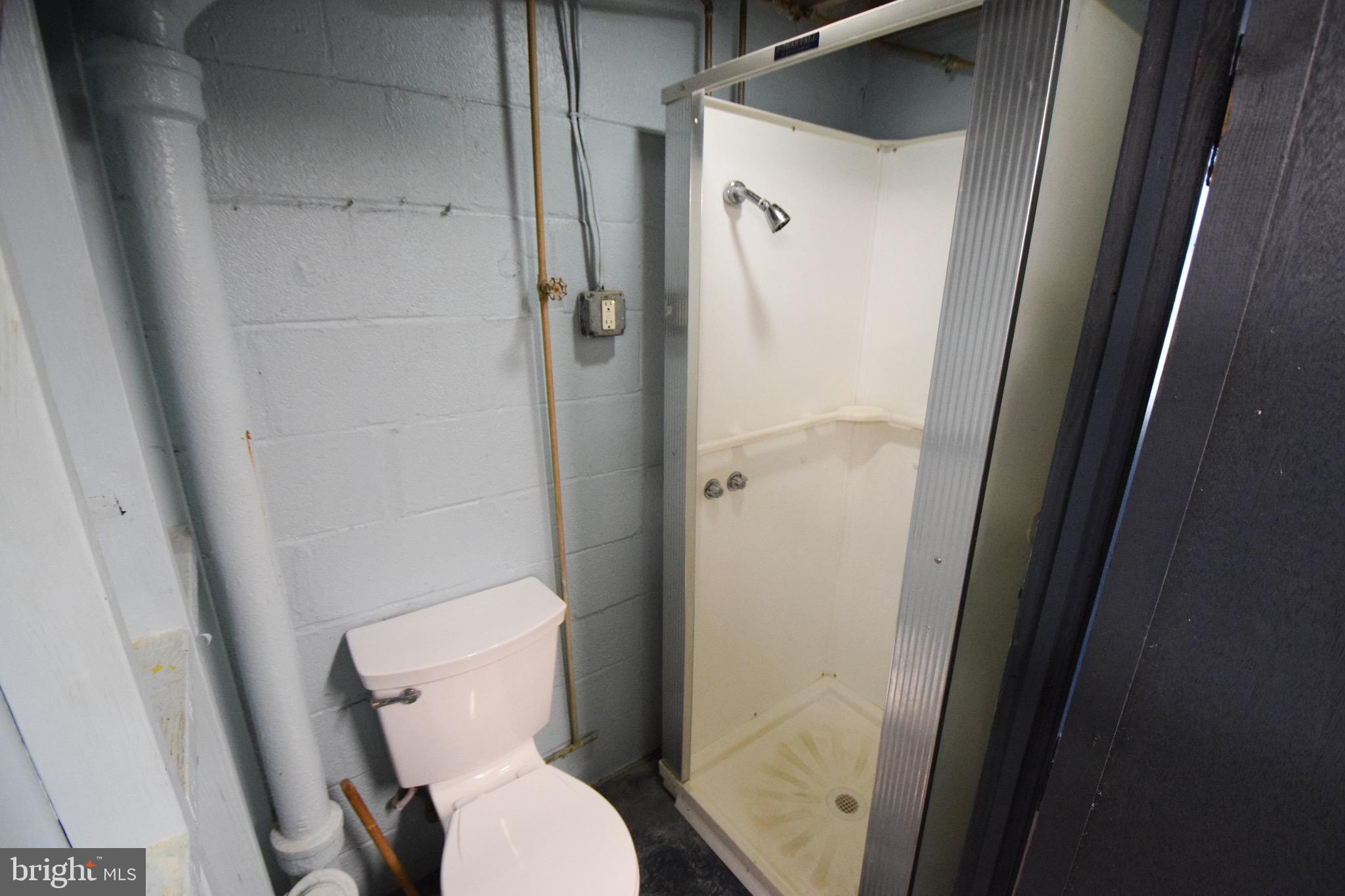 1922 Armco Way Dundalk, MD 21222 - Photo 24 of 26 a white toilet sitting next to a shower