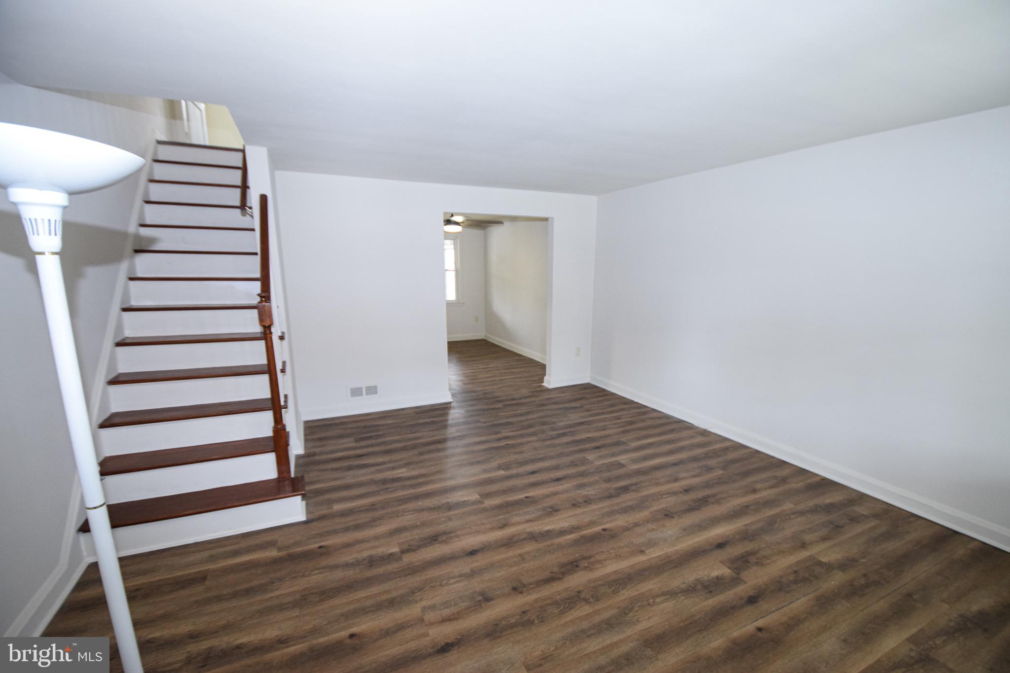 1922 Armco Way Dundalk, MD 21222 - Photo 3 of 26 a view of a livingroom with wooden floor
