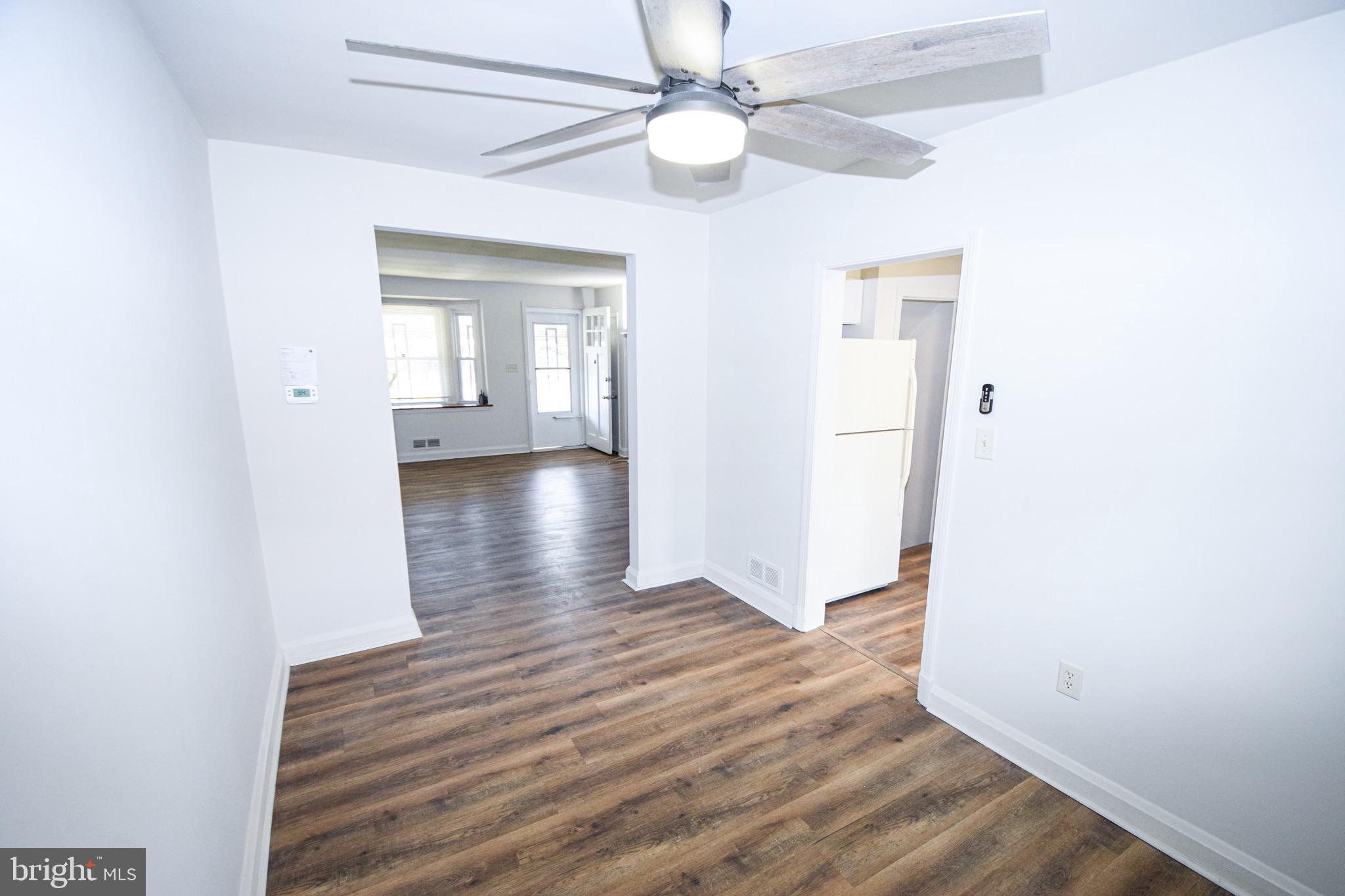 1922 Armco Way Dundalk, MD 21222 - Photo 6 of 26 a view of a hallway with wooden floor