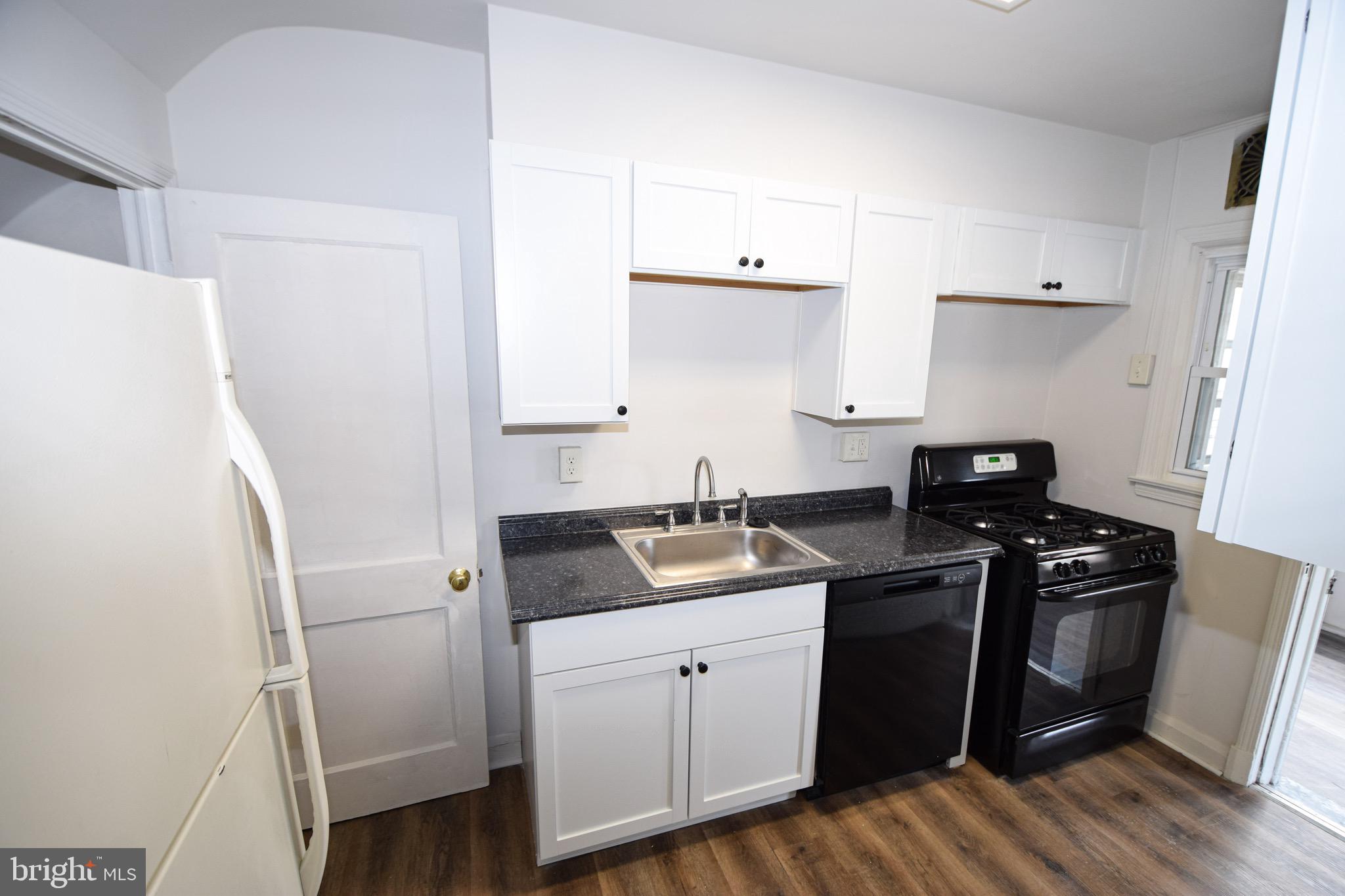 1922 Armco Way Dundalk, MD 21222 - Photo 7 of 26 a kitchen with a sink a stove and refrigerator