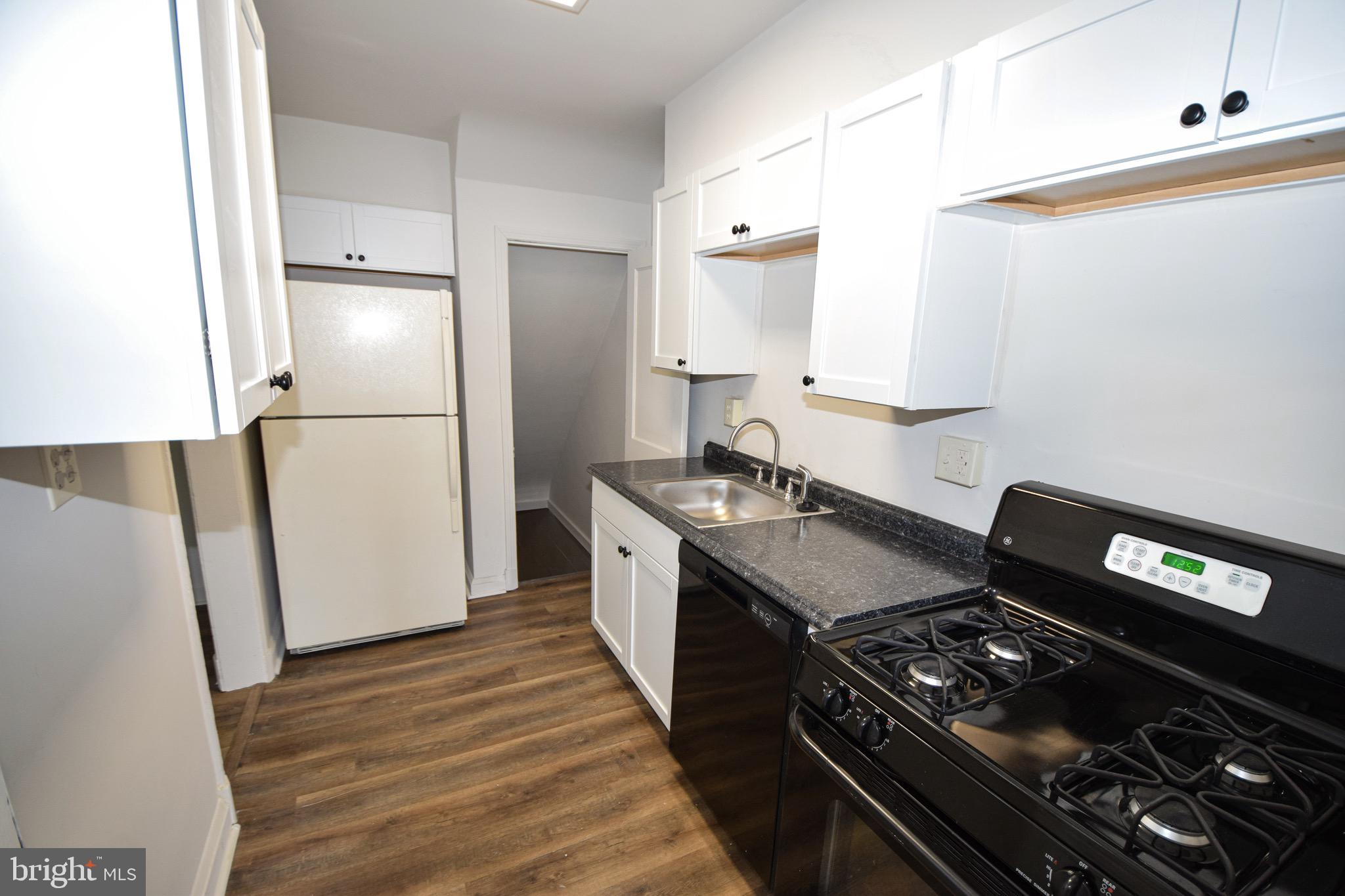 1922 Armco Way Dundalk, MD 21222 - Photo 9 of 26 a kitchen with a stove and a refrigerator