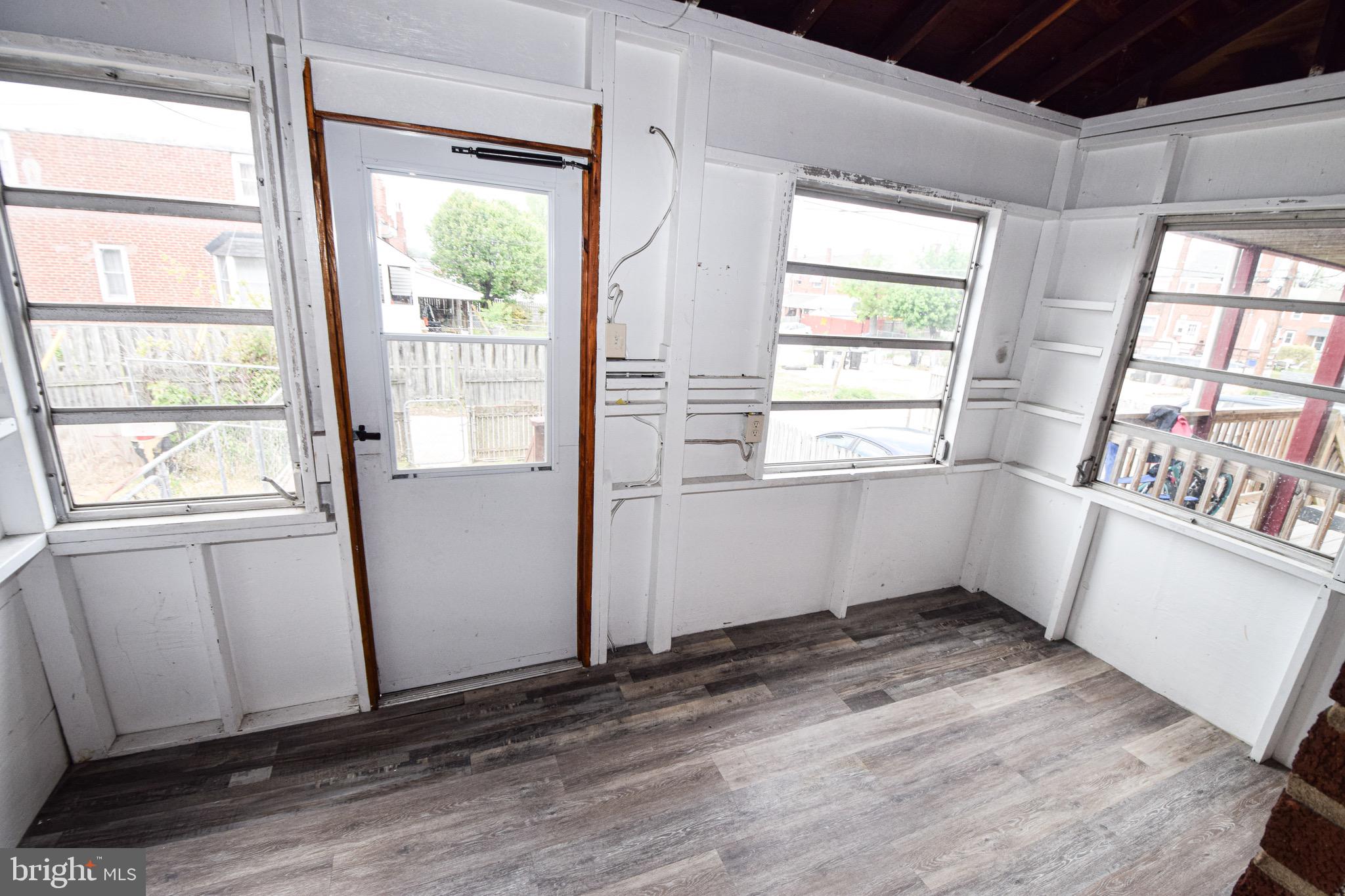 1922 Armco Way Dundalk, MD 21222 - Photo 10 of 26 a view of empty room with wooden floor and fan