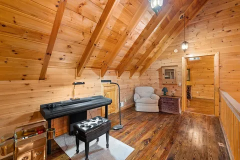 a room with furniture and wooden floor