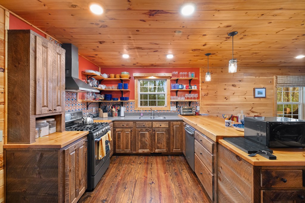 148 Dream Cove Road Cherry Log, GA 30522 - Photo 4 of 29 a kitchen with stainless steel appliances sink stove and cabinets