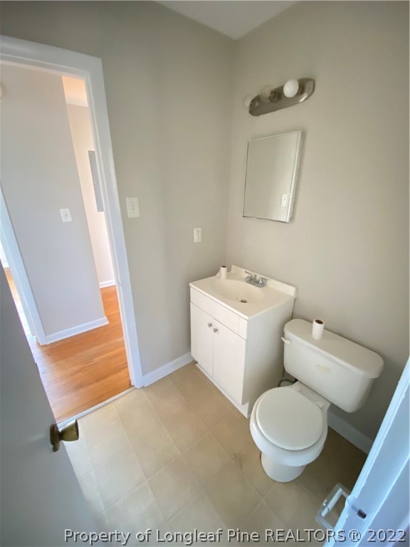 3518 Drayton Road Fayetteville, NC 28303 - Photo 12 of 17 a white toilet sitting next to a bathroom sink
