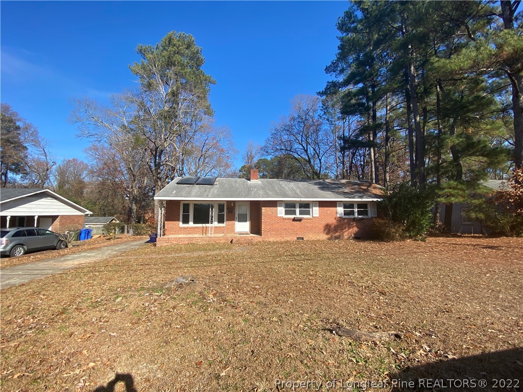 3518 Drayton Road Fayetteville, NC 28303 - Photo 2 of 17 a front view of a house with a yard and garage