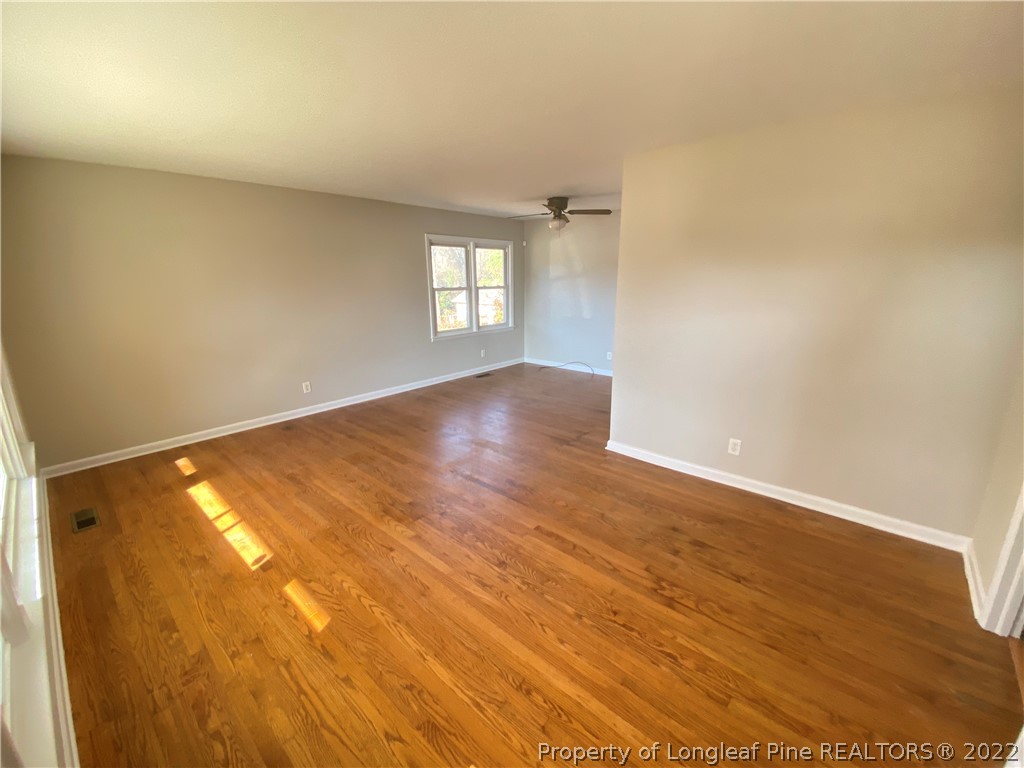 3518 Drayton Road Fayetteville, NC 28303 - Photo 3 of 17 an empty room with windows and closet