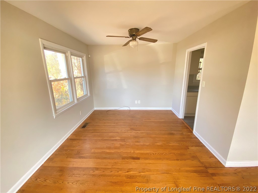 3518 Drayton Road Fayetteville, NC 28303 - Photo 4 of 17 a view of a big room with windows and closet