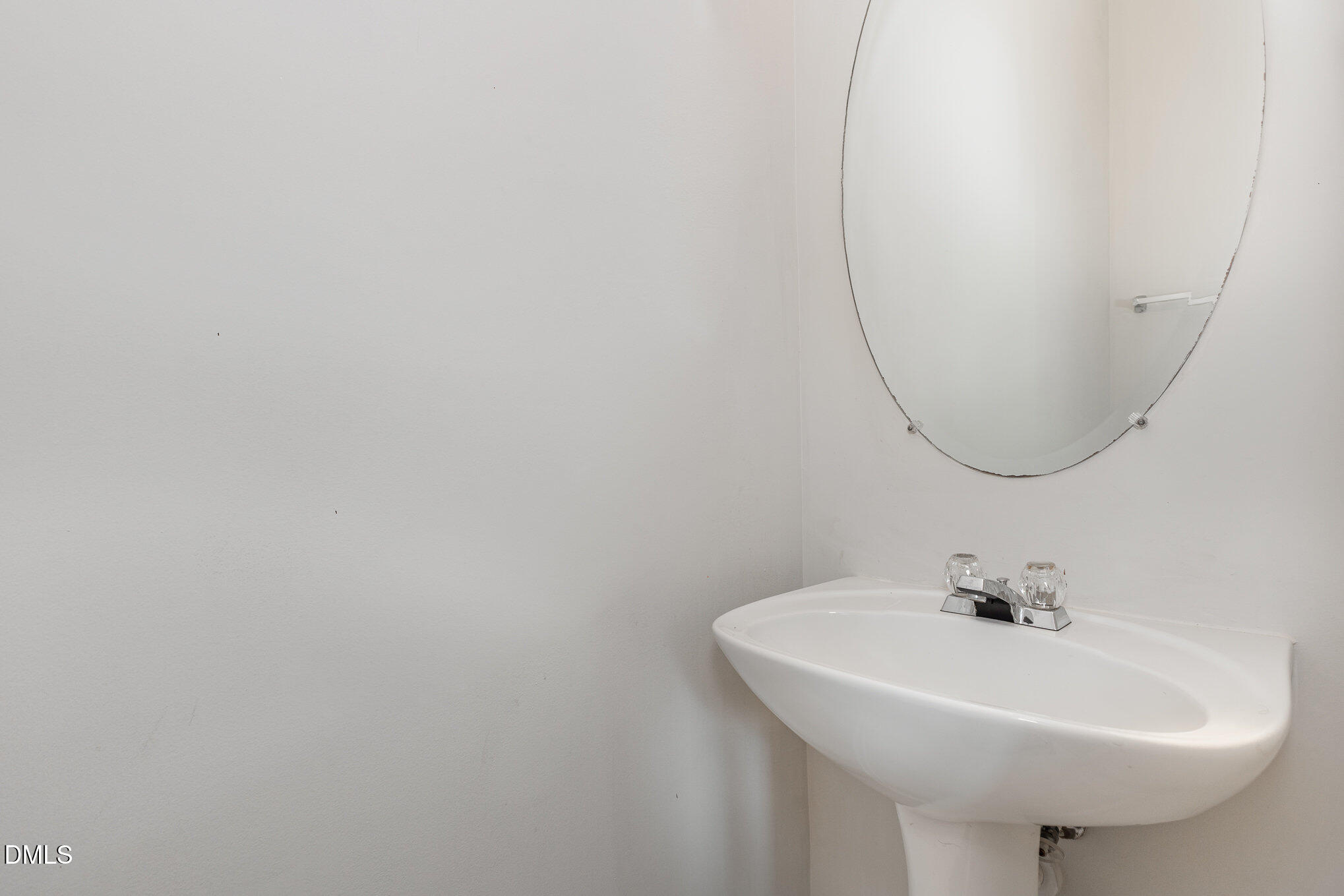 10947 Pendragon Place Raleigh, NC 27614 - Photo 19 of 21 a bathroom with a sink and a mirror