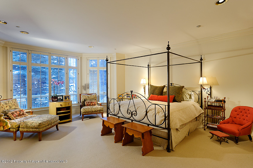 102 North Spring Street, Unit #2 Aspen, CO 81611 - Photo 11 of 18 a bedroom with furniture and large windows