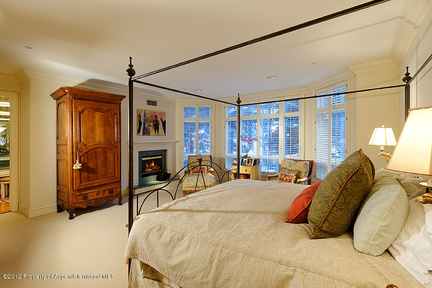 102 North Spring Street, Unit #2 Aspen, CO 81611 - Photo 12 of 18 a bed room with a bed and a television