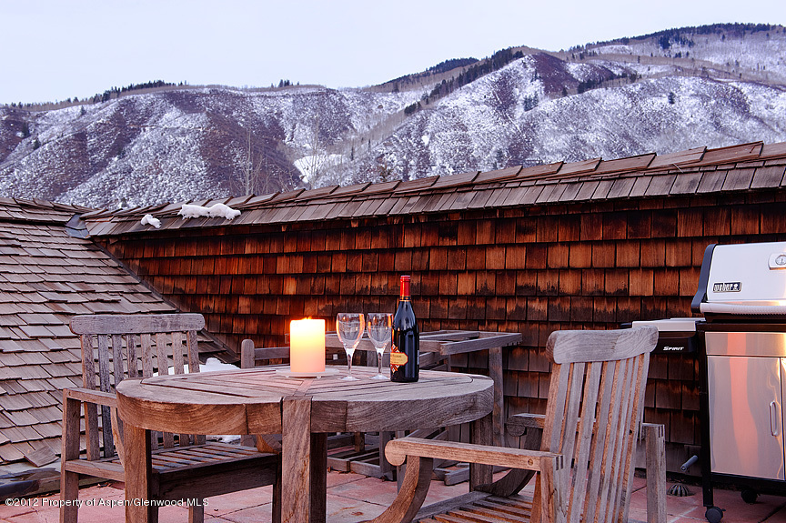 102 North Spring Street, Unit #2 Aspen, CO 81611 - Photo 17 of 18 a roof deck view with table and chairs