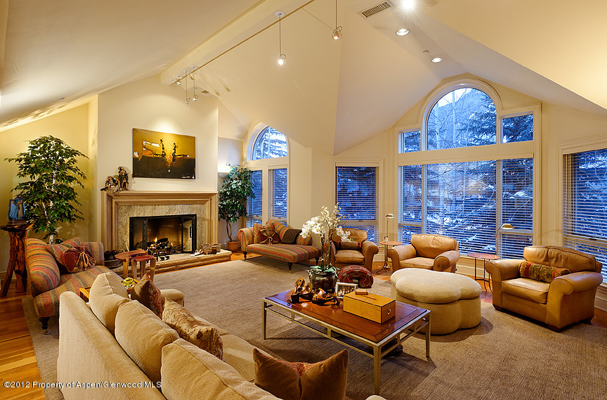 102 North Spring Street, Unit #2 Aspen, CO 81611 - Photo 2 of 18 a living room with furniture fireplace and a large window