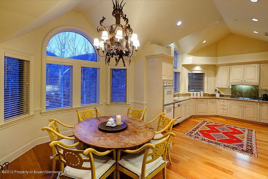 102 North Spring Street, Unit #2 Aspen, CO 81611 - Photo 7 of 18 a view of a dining room with furniture and a chandelier