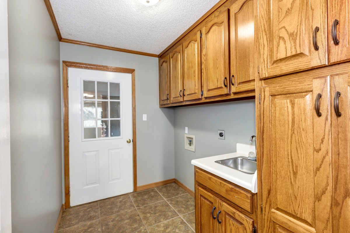 27294 Gatlin Road Ardmore, AL 35739 - Photo 22 of 29 a bathroom with a granite countertop sink and a window