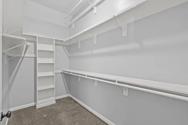 a view of an empty walk in closet