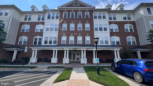 a view of a brick building with many windows