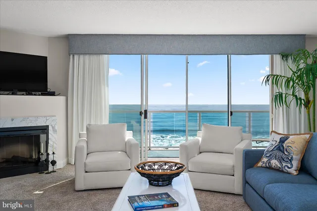 a living room with furniture fireplace and a flat screen tv