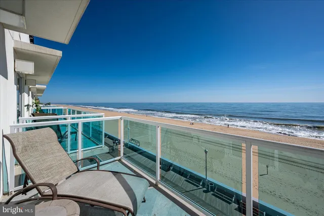 a bedroom with a bed couch and window