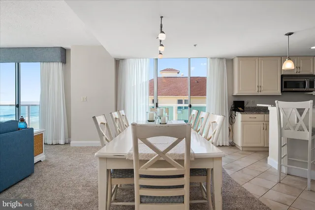 a bathroom with a granite countertop sink a toilet and a mirror