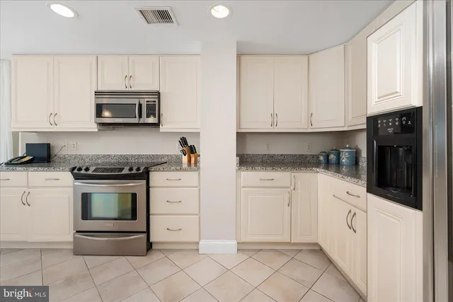 a bedroom with a bed chair and window