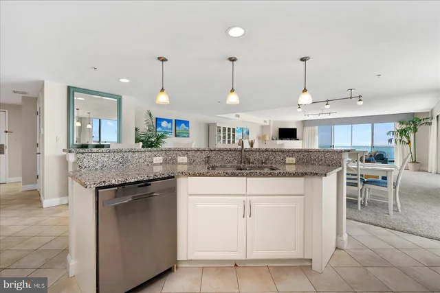 a bathroom with a sink mirror and toilet