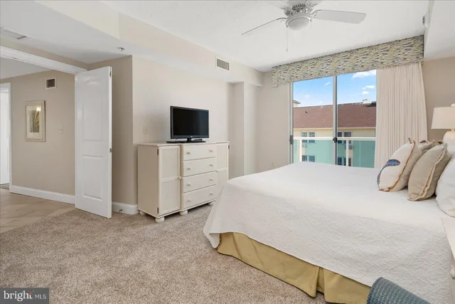 a view of a swimming pool with outdoor seating