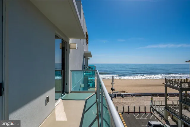 a view of a living room and kitchen