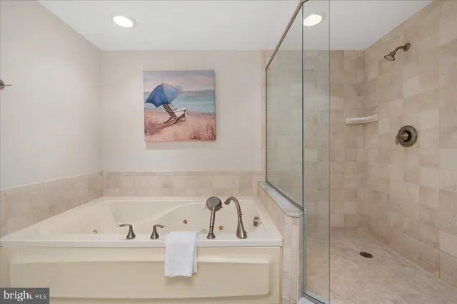 a living room with fireplace furniture and a large window