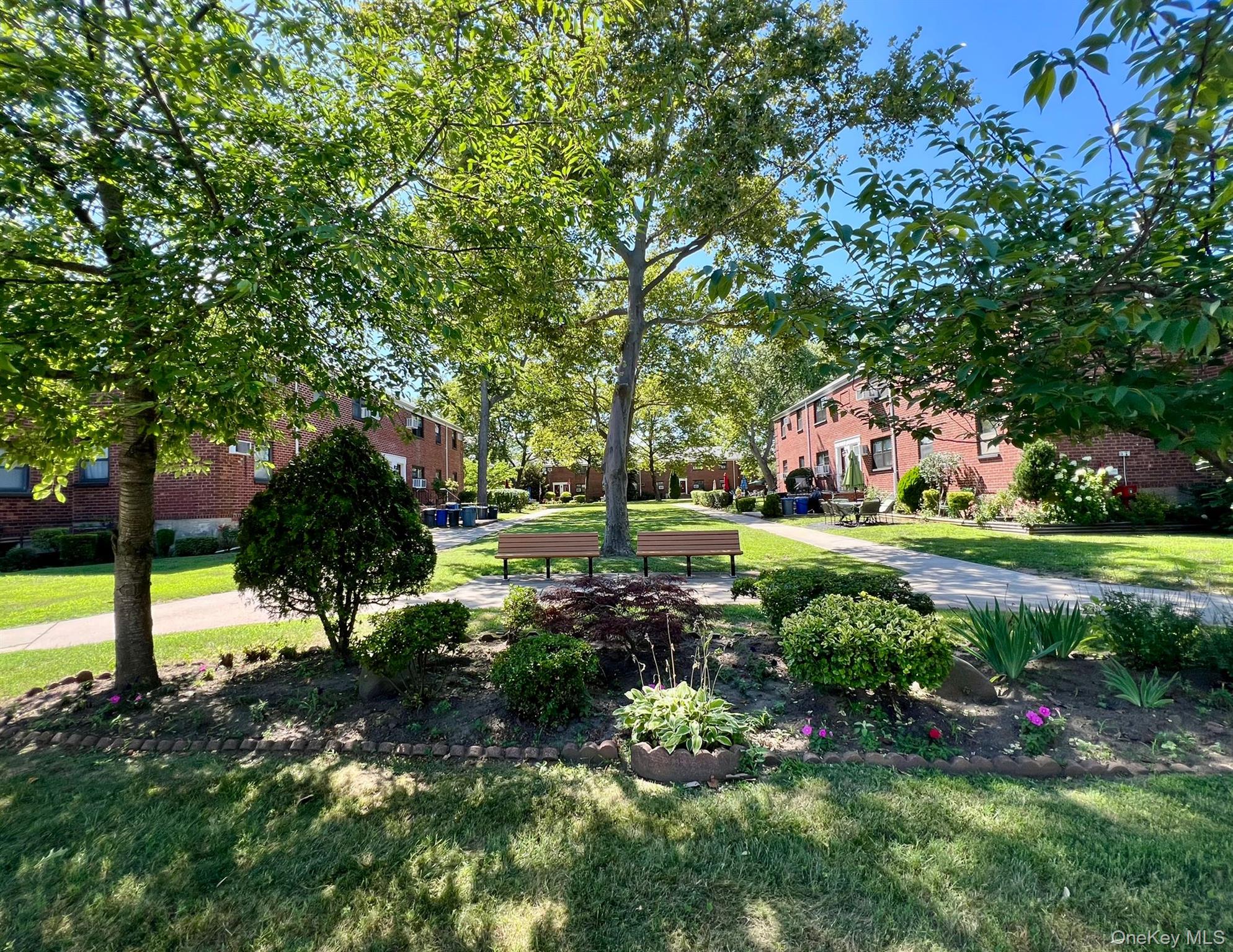 17-72 166th Street, Unit 2 Queens, NY 11357 - Photo 13 of 13 a view of yard with swimming pool and green space