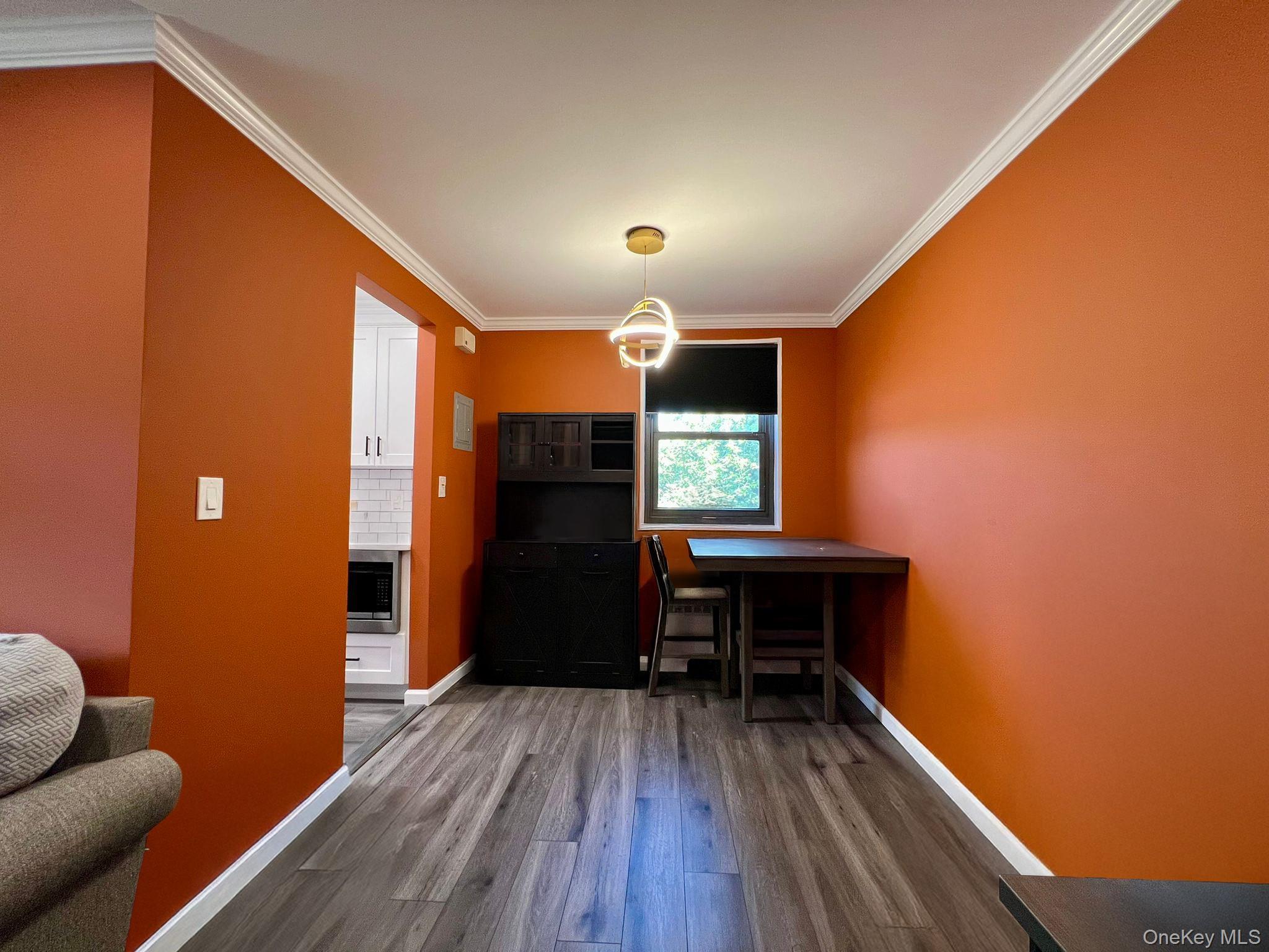 17-72 166th Street, Unit 2 Queens, NY 11357 - Photo 4 of 13 a view of a livingroom with furniture and wooden floor