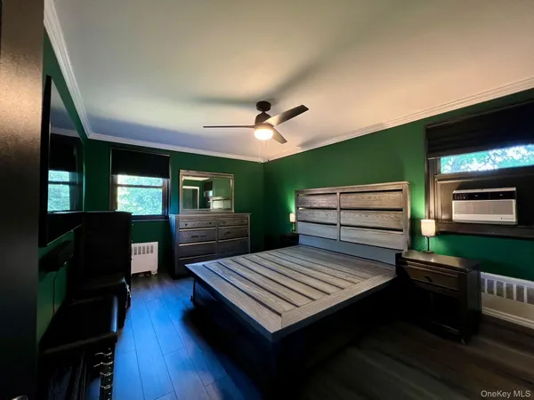 a view of a livingroom with furniture and a kitchen
